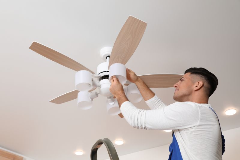 Handyman installing a ceiling fan